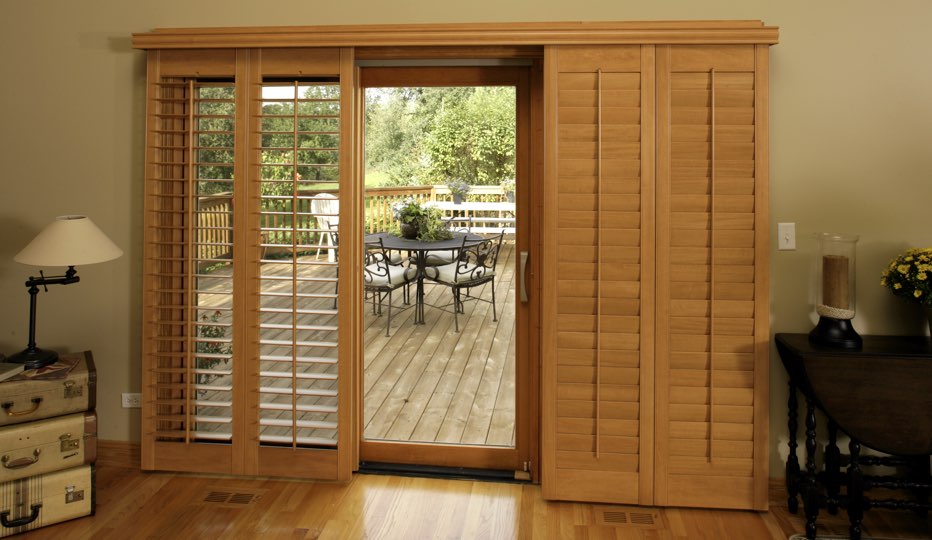 Bypass wood patio door shutters in Sacramento living room